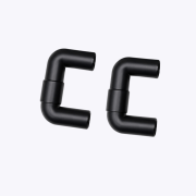 Close-up of black metal pipe elbows forming curved joints against a light background